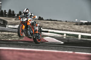 Racer Jumping With Ktm Duke 200 Wallpaper