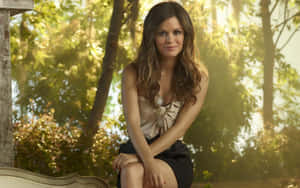 Rachel Bilson Smiling Radiantly Against A Nature-inspired Background Wallpaper