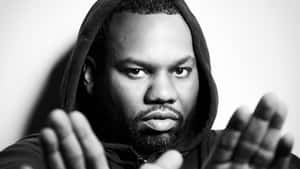 Raekwon Hooded Glance Blackand White Wallpaper