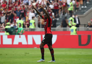 Rafael Leao Celebratingon Pitch Wallpaper