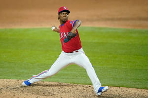 Rafael Montero Wearing Red Uniform Wallpaper