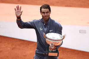 Rafael Nadal Holding Silver Trophy Wallpaper