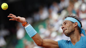 Rafael Nadal Throwing Ball Up Wallpaper