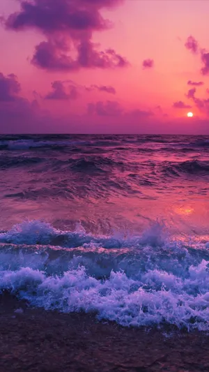 Raging Ocean Waves Over Aesthetic Sunset Wallpaper