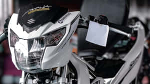 Raider 150 Fi Front Headlight Closeup Wallpaper