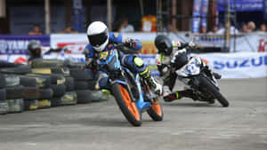 Raider 150 Fi Racing Action Wallpaper