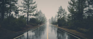 Rain Blurs The Pavement Of A Busy Highway Wallpaper