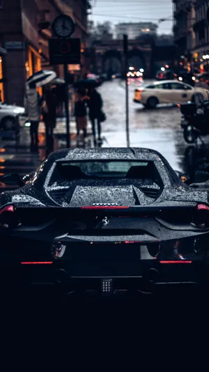 Rainy Cityscapewith Sports Car Wallpaper
