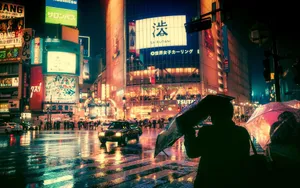 Rainy Night Cityscapewith Neon Lights Wallpaper