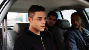 Rami Malek Car Scene Wallpaper