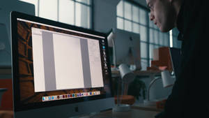 Rami Malek Utilizing His Imac Wallpaper