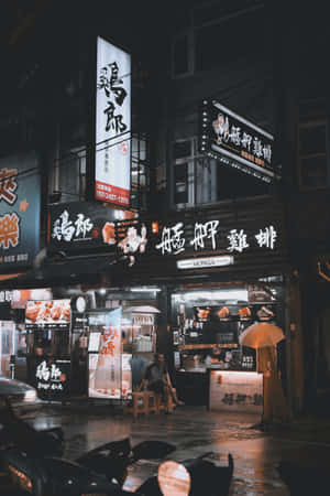 Random Person Enjoying Street Food Wallpaper