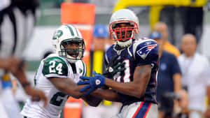 Randy Moss Catch Against Jets Defender Wallpaper