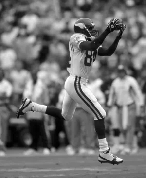 Randy Moss Catching Football In Game Wallpaper