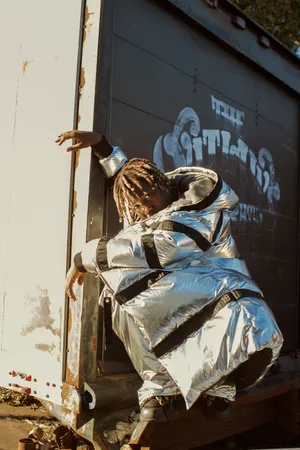 Rapper Don Toliver Smiling In A White Hat Wallpaper