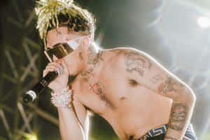 Rapper Lil Pump Performing Onstage Wallpaper