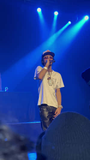 Rapper Performance Under Blue Lights.jpg Wallpaper