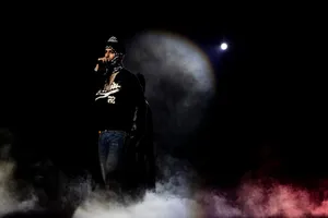 Rapper Performance Under Spotlight Wallpaper