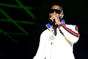 Rapper Performingon Stage Wallpaper