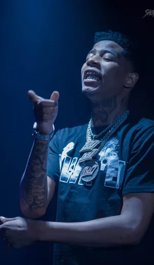 Rapper Performingon Stage Wallpaper