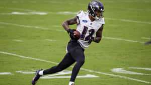 Rashod Bateman Baltimore Ravens Game Action Wallpaper