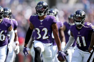 Ravens Defensive Backsin Action Wallpaper