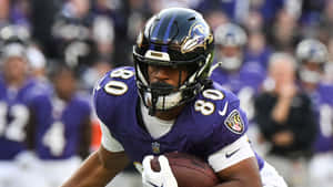 Ravens Player Catching Football Wallpaper