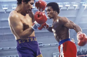 Ray Leonard Boxing With A Blue Backdrop Wallpaper