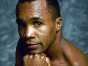 Ray Leonard Posing In Front Of Blue Backdrop Wallpaper