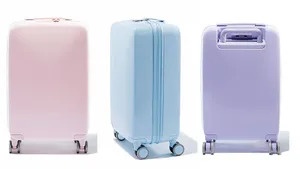 Ready To Explore The World With A Distinctive Purple Luggage Wallpaper