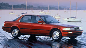 Red Acura Vigor On Wet Dock Wallpaper