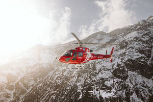 Red And White Flying Helicopter Wallpaper