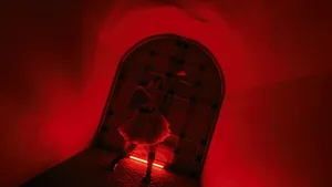 Red Archway Guitar Performance Wallpaper