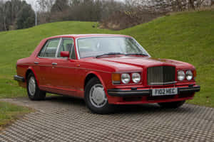 Red Bentley Turbo R Parked Outdoors Wallpaper