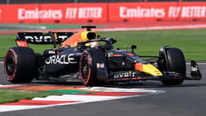 Red Bull Racing F1 Car Action On Track Wallpaper