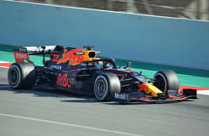 Red Bull Racing F1 Car Speeding On Track.jpg Wallpaper