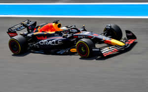 Red Bull Racing F1 Car Speedingon Track Wallpaper