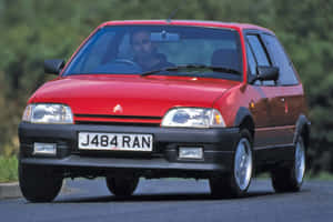 Red Citroen A X On The Road Wallpaper