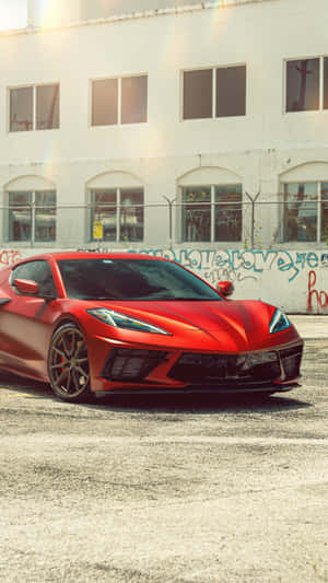 Red Corvette C8 Urban Backdrop Wallpaper