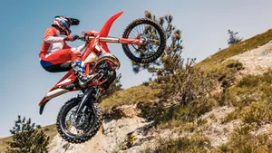 Red Dirt Bike Midair Jump Wallpaper