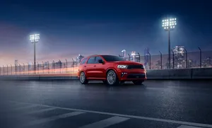 Red Dodge Durango Night Cityscape Wallpaper