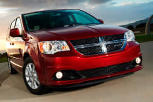 Red Dodge Grand Caravanat Dusk Wallpaper