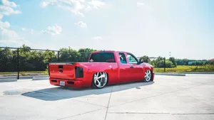Red Dropped Truck On Concrete Wallpaper