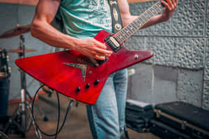 Red Electric Guitar Performance.jpg Wallpaper