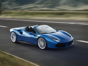 Red Ferrari 488 Spider Speeding On The Road Wallpaper