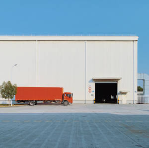 Red Freight Truck Near Building Wallpaper