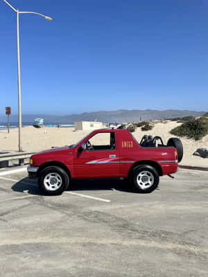 Red Isuzu Amigo Beachside Parking Wallpaper