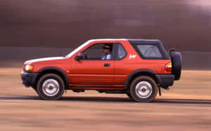 Red Isuzu Amigo On The Move Wallpaper