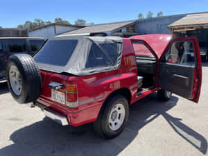 Red Isuzu Amigo Open Door Wallpaper