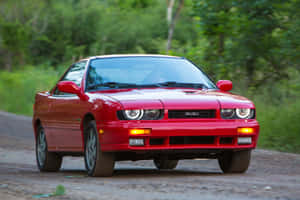 Red Isuzu Impulse On Road Wallpaper